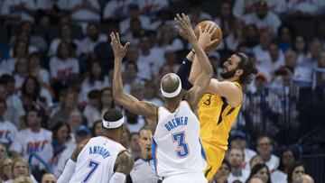 OKLAHOMA CITY, OK - APRIL 18: Ricky Rubio #3 of the Utah Jazz shoots over Carmelo Anthony #7 of the Oklahoma City Thunder and Corey Brewer #3 of the Oklahoma City Thunder during the second half of game 2 of the Western Conference playoffs at the Chesapeak
