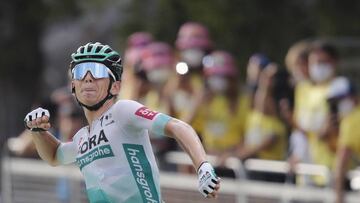 Stage winner Team Bora rider Germany's Lennard Kamna celebrates as he crosses the finish line of the 16th stage of the 107th edition of the Tour de France cycling race, 164 km between La Tour du Pin and Villard-de-Lans, on September 15, 2020. (Photo by Christophe Ena / various sources / AFP)