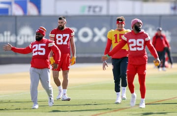 Quarterback Patrick Mahomes #15 and tight end Travis Kelce #87 warm-up during Kansas City Chiefs practice.