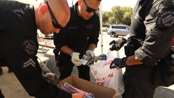 LAPD Bomb Squad officers place illegal fireworks in boxes that were dropped off during the second annual Anonymous Fireworks Buyback Program in Brand Park in Mission Hills on July 2, 2022.