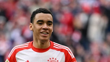 Bayern Munich's German midfielder #42 Jamal Musiala celebrates scoring his team's fifth goal during the German first division Bundesliga football match Bayern Munich v Mainz 05 in Munich, southern Germany on March 9, 2024. (Photo by LUKAS BARTH / AFP) / DFL REGULATIONS PROHIBIT ANY USE OF PHOTOGRAPHS AS IMAGE SEQUENCES AND/OR QUASI-VIDEO