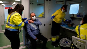 A man is administered a coronavirus disease (COVID-19) vaccine in a mobile medical station, in Oronoz-Mugaire, Baztan, Navarre, Spain January 19, 2021. REUTERS/Vincent West