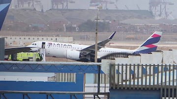 This grab from an AFP video shows the LA2213 flight plane after it collided with a firefighting vehicle at the Jorge Chavez International Ariport in Lima, on November 18, 2022. - Two firefighters died this Friday after their vehicle collided with a Latam airline plane that was taking off from the Lima airport for a domestic flight, an incident that the Peruvian prosecutor's office will investigate "for possible crimes of homicide and injuries." (Photo by Christian SIERRA / AFPTV / AFP) (Photo by CHRISTIAN SIERRA/AFPTV/AFP via Getty Images)