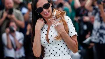 Cast member Demi Moore poses with a dog during a photocall for the film "The Substance" in competition at the 77th Cannes Film Festival in Cannes, France, May 20, 2024. REUTERS/Stephane Mahe