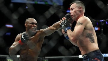 Kamaru Usman golpea a Colby Covington.