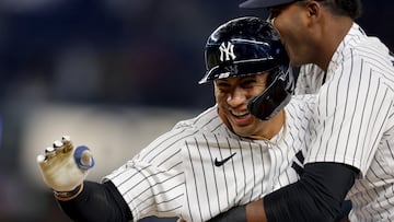 Apr 19, 2023; Bronx, New York, USA; New York Yankees second baseman Gleyber Torres (25) celebrates with right fielder Franchy Cordero (33) after hitting the walkoff sacrifice fly during the tenth inning against the Los Angeles Angels at Yankee Stadium. Mandatory Credit: Brad Penner-USA TODAY Sports