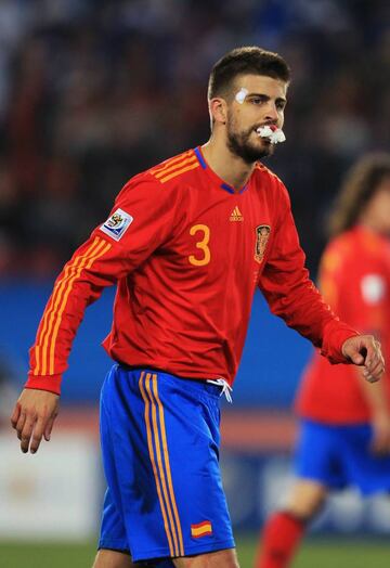 Battered and bruised during the 2010 World Cup: Piqué's commitment on the field for the Spanish national side has never been in doubt