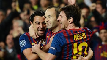 Andres Iniesta celebra un gol junto a Lionel Messi y Xavi Hernandez durante el partido de vuelta de cuartos de final de la Champions League entre el FC Barcelona y el AC Milan en el Camp Nou el 3 de abril de 2012 (Foto Jasper Juinen/Getty Images)