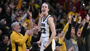 Feb 15, 2024; Iowa City, Iowa, USA; Iowa Hawkeyes guard Caitlin Clark (22) reacts with fans after breaking the NCAA women's all-time scoring record during the first quarter against the Michigan Wolverines at Carver-Hawkeye Arena. Mandatory Credit: Jeffrey Becker-USA TODAY Sports