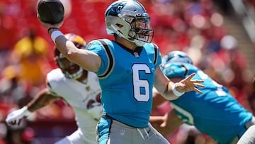 Baker Mayfield of the Carolina Panthers looks to pass against the Washington Commanders during the first half of the preseason game at FedExField on August 13, 2022 in Landover, Maryland.