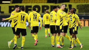 Dortmund (Germany), 13/03/2021.- Youssoufa Moukoko (R) of Borussia Dortmund celebrates with teammate Erling Haaland (2-R) after scoring their team's second goal during the German Bundesliga soccer match between Borussia Dortmund and Hertha BSC at Sig