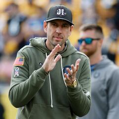 Why are NFL coaches and sideline staff wearing camo hoodies? Significance of the green sweatshirts