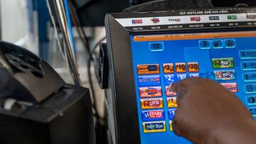 HOUSTON, TEXAS - JULY 28: A Chevron employee rings up a Mega Millions lottery ticket on July 28, 2022 in Houston City. The lottery jackpot has increased to $1 Billion after not being matched Tuesday night. (Photo by Brandon Bell/Getty Images)