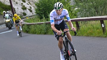 UAE Team Emirates' Slovenian rider Tadej Pogacar wearing the best young rider's white jersey (R) cycles ahead of Jumbo-Visma's Danish rider Jonas Vingegaard wearing the overall leader's yellow jersey in the ascent of the Puy de Dome in the final kilometers of the 9th stage of the 110th edition of the Tour de France cycling race, 182,5 km between Saint-Leonard-de-Noblat and Puy de Dome, in the Massif Central volcanic mountains in central France, on July 9, 2023. (Photo by Bernard PAPON / POOL / AFP)