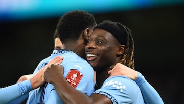Soccer Football - FA Cup - Third Round - Manchester City v Salford City - Etihad Stadium, Manchester, Britain - January 11, 2025 Manchester City's Jeremy Doku celebrates scoring their sixth goal with Divin Mubama REUTERS/Peter Powell