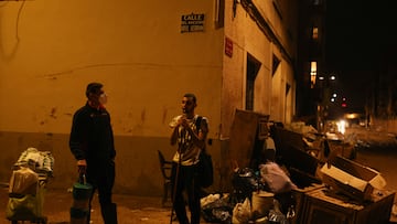 Residents stand next to damaged belongings, in the aftermath of floods caused by heavy rains, in Paiporta, near Valencia, Spain, November 4, 2024. REUTERS/Nacho Doce