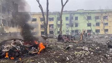 A view shows cars and a building of a hospital destroyed by an aviation strike amid Russia&#039;s invasion of Ukraine, in Mariupol, Ukraine, in this handout picture released March 9, 2022.  Press service of the National Police of Ukraine/Handout via REUTE