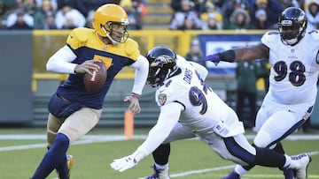 Nov 19, 2017; Green Bay, WI, USA;  Green Bay Packers quarterback Brett Hundley (7) avoids a tackle by Baltimore Ravens defensive tackle Carl Davis (94) in the second quarter at Lambeau Field. Mandatory Credit: Benny Sieu-USA TODAY Sports