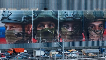 Traffic moves along a road past a screen promoting Russian armed forces ahead of Defender of the Fatherland Day, an annual national holiday that honours Russian military achievements, soldiers and veterans, in Moscow, Russia February 21, 2025. REUTERS/Yulia Morozova