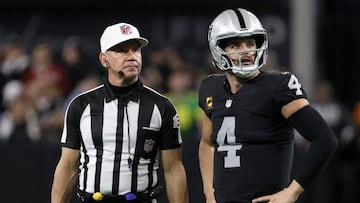 LAS VEGAS, NEVADA - JANUARY 09: Referee Clete Blakeman waits for quarterback Derek Carr #4 of the Las Vegas Raiders to call a timeout with two seconds left in overtime of a game against the Los Angeles Chargers at Allegiant Stadium on January 9, 2022 in Las Vegas, Nevada. Kicker Daniel Carlson #2 of the Raiders made a 47-yard field goal after the timeout to defeat the Chargers 35-32.   Ethan Miller/Getty Images/AFP
 == FOR NEWSPAPERS, INTERNET, TELCOS &amp; TELEVISION USE ONLY ==