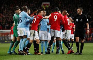 Dive | Manchester United's Ander Herrera remonstrates with referee Michael Oliver before being shown a yellow card for simulation.