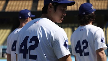 LOS ANGELES, CALIFORNIA - APRIL 15: Shohei Ohtani #17 of the Los Angeles Dodgers makes his way back to the dugout before the game against the Washington Nationals on Jackie Robinson Day at Dodger Stadium on April 15, 2024 in Los Angeles, California. All players are wearing the number 42 in honor of Jackie Robinson Day.   Harry How/Getty Images/AFP (Photo by Harry How / GETTY IMAGES NORTH AMERICA / Getty Images via AFP)