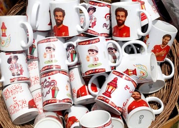 Decorative mugs bearing the image of Liverpool's Egyptian forward soccer player Mohamed Salah, are seen at a market, before the beginning of the holy fasting month of Ramadan in Cairo, Egypt May 2, 2018. Arabic words read "Ramadan is sweeter with Salah".