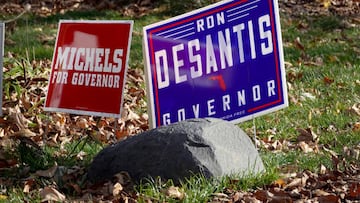MUSKEGO, WISCONSIN - NOVEMBER 06: Signs supporting Wisconsin Republican gubernatorial candidate Tim Michels and Florida Governor Ron Desantis sit in the yard in front of a home before a visit from Michels at a nearby bar on November 6, 2022 in Muskego, Wisconsin. Michels is in a close race with incumbent Democrat Gov. Tony Evers ahead of Tuesday's general election.  (Photo by Scott Olson/Getty Images)