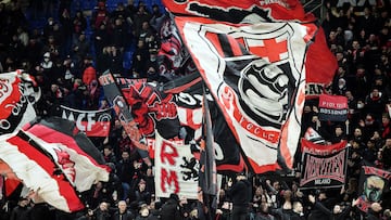 AC Milan fans wave flags inside the stadium