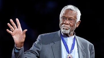 FILE PHOTO: Boston Celtics' great Bill Russell stands with his Presidential Medal of Freedom during the NBA All-Star basketball game in Los Angeles, February 20, 2011. REUTERS/Danny Moloshok/File Photo