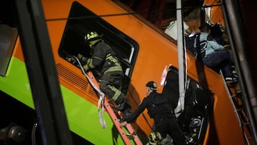 Rescuers work at a site where an overpass for a metro partially collapsed with train cars on it at Olivos station in Mexico City, Mexico May 03, 2021. Luis Cortes/REUTERS