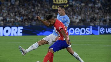 Atletico Madrid's Brazilian forward #12 Samuel Lino (back) fights for the ball with Lazio's Montenegrin defender #77 Adam Marusic during the UEFA Champions League 1st round group E football match between Lazio and Atletico Madrid at the Olympic stadium in Rome on September 19, 2023. (Photo by Filippo MONTEFORTE / AFP)