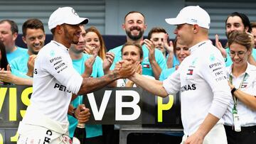 MONZA, ITALY - SEPTEMBER 02: Race winner Lewis Hamilton of Great Britain and Mercedes GP celebrates with third placed Valtteri Bottas driving the (77) Mercedes AMG Petronas F1 Team Mercedes WO9 after the Formula One Grand Prix of Italy at Autodromo di Monza on September 2, 2018 in Monza, Italy. (Photo by Mark Thompson/Getty Images)