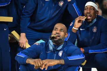 LeBron James and Anthony Davis pose on the podium after the men's Gold Medal basketball final.