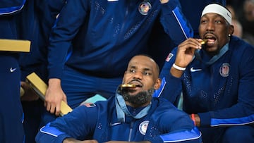 Gold medallists USA's #06 LeBron James and USA's #14 Anthony Davis (R) pose on the podium after the men's Gold Medal basketball match between France and USA during the Paris 2024 Olympic Games at the Bercy Arena in Paris on August 10, 2024. (Photo by Damien MEYER / AFP)