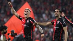 Luis Reyes (L) and Gaddi Aguirre (R) of Atlas celebrate after defeating Pumas during their Mexican Apertura tournament semifinal football match at Jalisco stadium in Guadalajara, Jalisco state, Mexico, on December 5, 2021. (Photo by Ulises Ruiz / AFP)