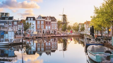 Leiden Old town cityscape, view of the Beestenmarkt and the De Valk mill reflecting in Rhine river on sunrise, South Holland, Netherlands