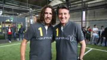 Puyol, en un acto previo a los Premios Laureus, con Sebastian Coe.