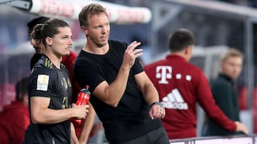 Bayern Munich&#039;s head coach Julian Nagelsmann (R) speaks to Bayern Munich&#039;s Austrian midfielder Marcel Sabitzer during the German first division Bundesliga football match RB Leipzig vs FC Bayern Munich in Leipzig, eastern Germany, on September 11