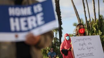 People hold signs during a rally in support of the Supreme Court&#039;s ruling in favor of the Deferred Action for Childhood Arrivals (DACA) program, in San Diego, California June 18, 2020. - Supreme Court dealt President Donald Trump&#039;s anti-immigrat