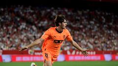 Valencia's Spanish midfielder #8 Javi Guerra celebrates scoring his team's second goal during the Spanish Liga football match between Sevilla FC and Valencia CF at the Ramon Sanchez Pizjuan stadium in Seville on August 11, 2023. (Photo by CRISTINA QUICLER / AFP)