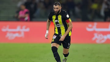 Ittihad's French forward #09 Karim Benzema runs with the ball during the Saudi Pro League football match between Al-Ittihad and Al-Nassr at King Abdullah Sports City Stadium in Jeddah on December 26, 2023. (Photo by AFP)