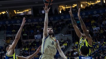 Wade Baldwin (L) and Brandon Boston Jr (R) of Fenerbahce in action against Dario Brizuela (C) of Barcelona during the Euroleague basketball match between Fenerbahce and Barcelona in Istanbul, Turkey, 23 December 2025.