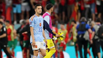 Spain's forward #22 Pablo Sarabia (L) reacts after losing the penalty shoot-out during the Qatar 2022 World Cup round of 16 football match between Morocco and Spain at the Education City Stadium in Al-Rayyan, west of Doha on December 6, 2022. (Photo by KARIM JAAFAR / AFP)