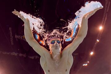 (FILES) An underwater view shows France's Leon Marchand competing in a heat of the men's 200m butterfly swimming event during the Paris 2024 Olympic Games at the Paris La Defense Arena in Nanterre, west of Paris, on July 30, 2024. (Photo by Oli SCARFF / AFP)