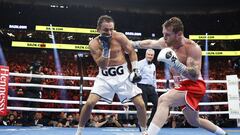LAS VEGAS, NEVADA - SEPTEMBER 17: Canelo Alvarez (red trunks) lands a punch against Gennadiy Golovkin (white trunks) in round five of the fight for the Super Middleweight Title at T-Mobile Arena on September 17, 2022 in Las Vegas, Nevada.   Sarah Stier/Getty Images/AFP