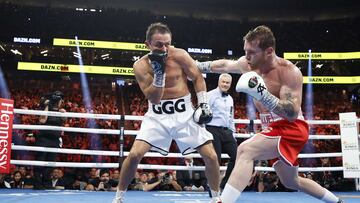 LAS VEGAS, NEVADA - SEPTEMBER 17: Canelo Alvarez (red trunks) lands a punch against Gennadiy Golovkin (white trunks) in round five of the fight for the Super Middleweight Title at T-Mobile Arena on September 17, 2022 in Las Vegas, Nevada. Sarah Stier/Getty Images/AFP