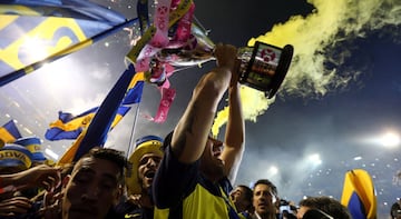 Boca Juniors' players celebrate with the trophy after they clinched the Argentine tournament.