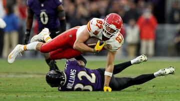 BALTIMORE, MARYLAND - JANUARY 28: Travis Kelce #87 of the Kansas City Chiefs is tackled by Marcus Williams #32 of the Baltimore Ravens after a catch during the second quarter in the AFC Championship Game at M&T Bank Stadium on January 28, 2024 in Baltimore, Maryland.   Patrick Smith/Getty Images/AFP (Photo by Patrick Smith / GETTY IMAGES NORTH AMERICA / Getty Images via AFP)