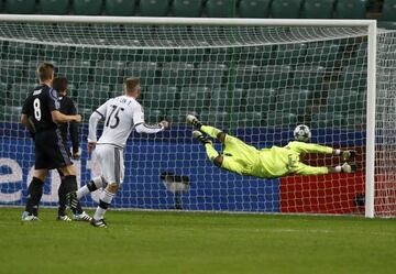 Warsaw's Thibault Moulin scores a goal past Madrid's Keylor Navas